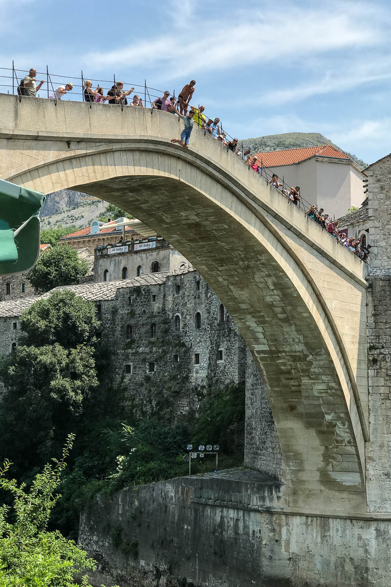 From the bridge from below with jumper on his way down